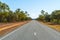 australian highway leads through the middle of the outback