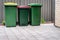 Australian home wheelie bins set on backyard