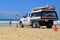 Australian Lifeguard vehicle with surfboard on beach
