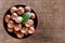 Australian macadamia nuts with leaf in plate