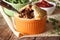 Australian meat pie in a pot on a background of green pea