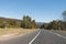 Australian outback road with wildlife signs of kangaroo and womb