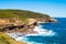 Australian rock formation with ocean in background, sandstone texture