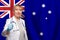 Australian smiling mature doctor woman holding stethoscope on flag of Australia background