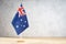 Australian table flag on white textured wall