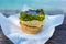 Australian traditional meat pie with Woolloomooloo bay on the ba