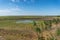 Australian wetlands landscape with small billabong, lake