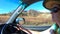 Australian woman driving to Kata Tjuta Olgas in Uluru-Kata Tjuta National Park Northern Territory Australia