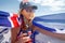 Australian woman holding a flag and beer bottle celebrating Australia