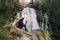 Austria. Bad Gastein. Girl at the waterfall in the Alpine