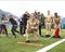 AUSTRIA, BAD HOFGASTEIN - July 1, 2023: Uniformed firefighters teach children how to put out a fire