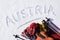 Austria ski vacation, word written in snow with skiing equipment