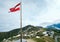 Austrian Flag above Alps mountain