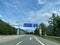 Austrian highway with road sign indicating Oeztaler Gletscher, Imst, Pitztal, Fernpass, Innsbruck.