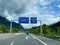 Austrian highway with road sign indicating Oeztaler Gletscher, Imst, Pitztal, Fernpass, Innsbruck.