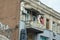 Authentic balcony of old building. Drying clothes