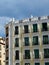 Authentic chic facade of baroque building with elegant windows, rounded stucco mouldings outside in the central part of Madrid,