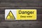 Authentic danger deep water sign with icon in warning triangle