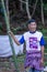 Authentic elder male supervising and helping for the construction of a mosque in Rammang rammang