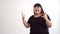 Authentic fat Asian girl dancing and enjoying life on white background. Life outside of the stereotypes of today`s youth