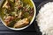 Authentic Ghormeh Sabzi dish of lamb stew meat with herbs and beans close-up in a bowl and rice. Horizontal top view