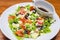 Authentic greek salad plate close up in Italian restaurant