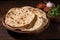 Authentic Indian cuisine chapati showcased on a rustic wooden background