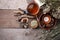Authentic interior details, glass of herbal rea, homeopathic treatment on rustic wooden background top view, alternative medicine