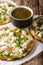 Authentic Mexican Chalupas with farm cheese and chicken meat closeup vertical