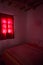 Authentic Moroccan bedroom in traditional riad with red light