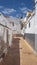 Authentic narrow alley passing through the small fishing village of La Caleta at siesta hours, Costa Adeje, Tenerife, Spain