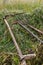 Authentic old pitchfork, rake and mower in the field