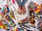 Authentic paint brushes still life on floor in art class school.