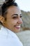 Authentic portrait close-up face latin woman looking away with smile