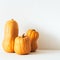 Authentic rustic pumpkin of different shapes with flaws , scratches and imperfections on white background,Fall background, harvest