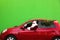 Authentic Santa Claus with fir tree driving car