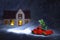 Authentic Santa Claus red car with a Christmas tree near the house. Night Christmas landscape with falling snow.