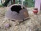 Authentic Second World War helmet with bullet hole. Rusty helmet on the grave - memorial in Orzega, Karelia. Helmet of a