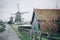 Authentic village house with traditional ecological hollands windmills in Netherlands