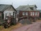 Authentic village on the shore of the Kandalaksha Bay of the White sea. The yard dog is on guard. Kola peninsula. Russia