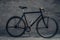 Authentic vintage single speed bicycle over grey background.