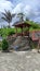 authentic wooden gazebo on a stone-shaped cement foundation