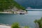 Authentic yacht sails past Verige 65 in the bay on a background of mountains