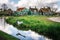 Authentic Zaandam mills and traditional vibrant houses on the water canal in Zaanstad village, Netherlands