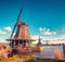 Authentic Zaandam mills on the water channel in Zaanstad village