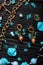 author collection jewelry with azure gemstones, pearls and chain demonstrated at black stones background. fashion and jewelry