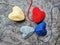 Autism awareness. Four knitted hearts on dark background.