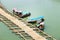 Auto boats landing at bamboo pier