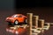 Auto finance Coins, piggy bank, and car model depict insurance