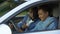 Auto instructor scolding young driver chatting smartphone lesson, safety rules